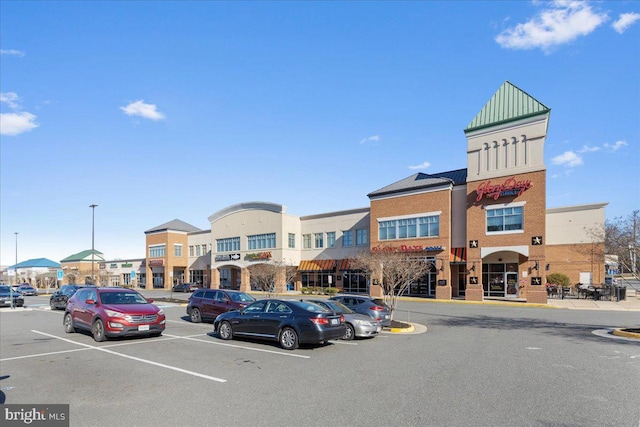 view of property with uncovered parking