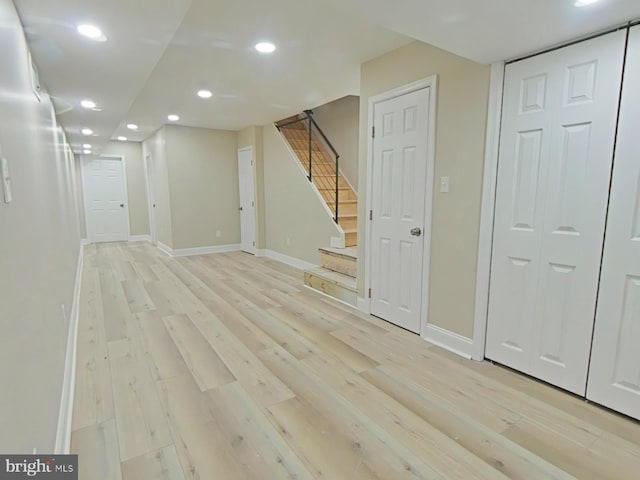 basement featuring light wood-type flooring