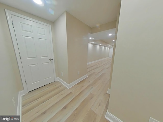 hall with light hardwood / wood-style floors