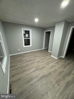 217 S 4th St, Vineland, NJ 08360 - unfurnished living room featuring baseboards, wood finished floors, and recessed lighting