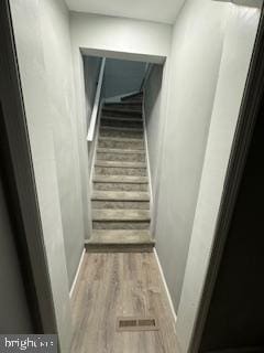 217 S 4th St, Vineland, NJ 08360 - stairs featuring wood finished floors