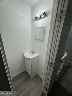 217 S 4th St, Vineland, NJ 08360 - bathroom with vanity, wood finished floors, and baseboards