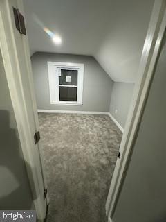 217 S 4th St, Vineland, NJ 08360 - bonus room featuring carpet, vaulted ceiling, and baseboards