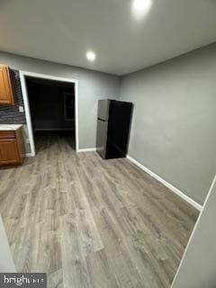 217 S 4th St, Vineland, NJ 08360 - unfurnished living room featuring light wood finished floors, baseboards, and recessed lighting