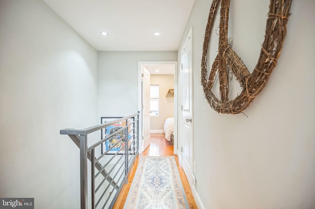 corridor featuring hardwood / wood-style floors