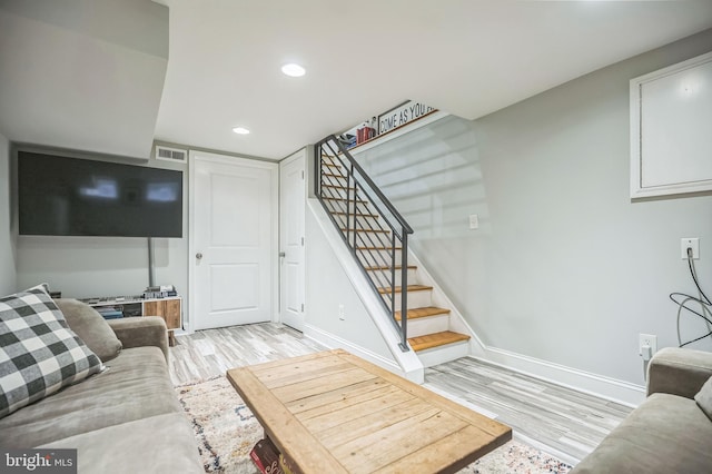 living room with light hardwood / wood-style flooring