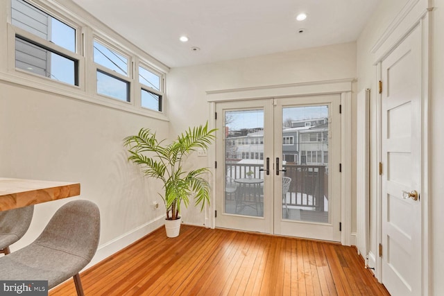 entryway with light hardwood / wood-style flooring and french doors