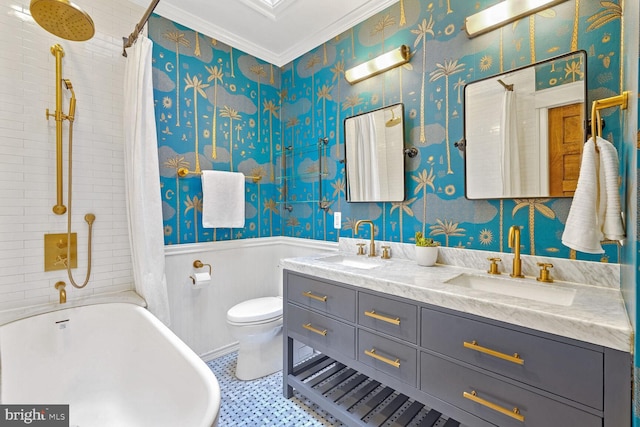 bathroom featuring toilet, vanity, and ornamental molding