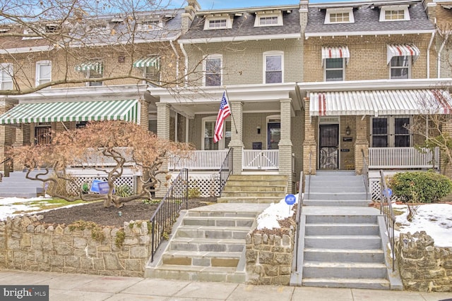 multi unit property featuring a porch