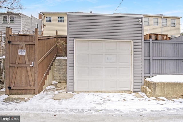 view of snow covered garage