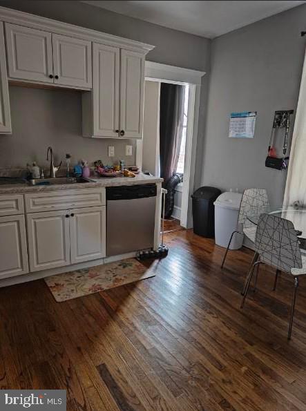 601 King St, Pottstown, PA 19464 - kitchen featuring dishwasher, a sink, dark wood finished floors, white cabinetry, and light countertops