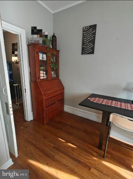 601 King St, Pottstown, PA 19464 - living area with crown molding, wood finished floors, and baseboards
