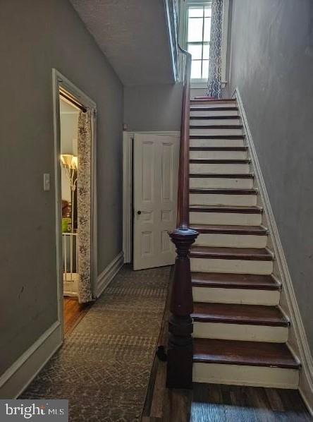 601 King St, Pottstown, PA 19464 - stairs featuring baseboards and wood finished floors