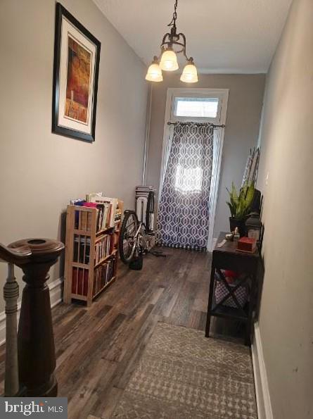 601 King St, Pottstown, PA 19464 - foyer with wood finished floors, a chandelier, and baseboards