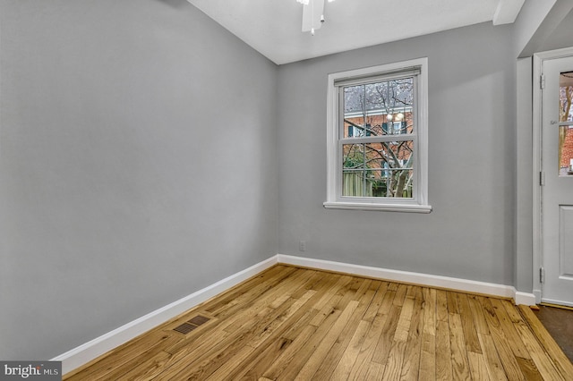 empty room with light hardwood / wood-style floors and ceiling fan