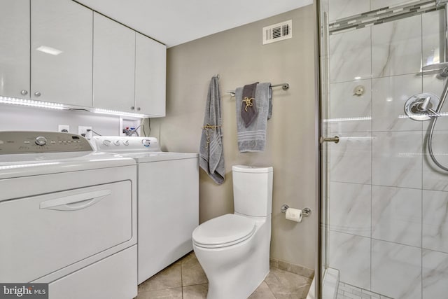 bathroom with walk in shower, washing machine and clothes dryer, tile patterned floors, toilet, and vanity