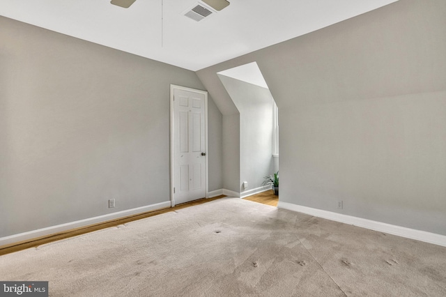 additional living space with vaulted ceiling and ceiling fan