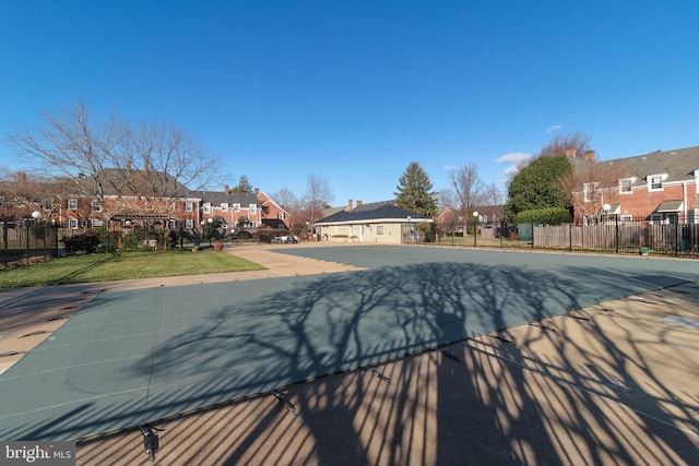 view of pool featuring a yard