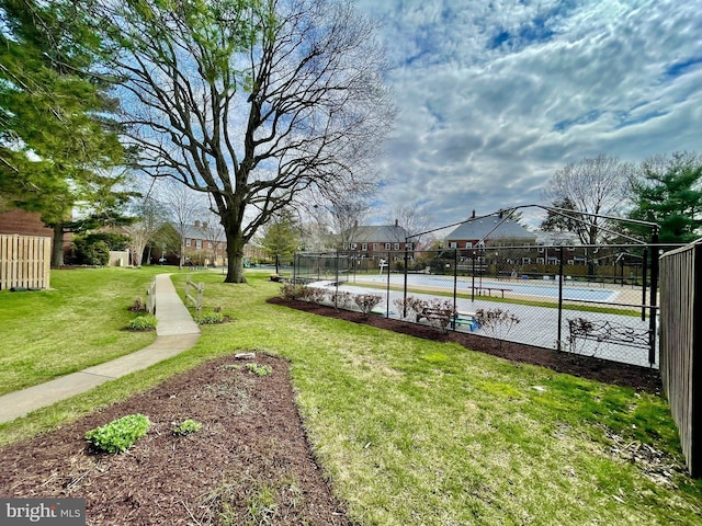 view of yard with tennis court