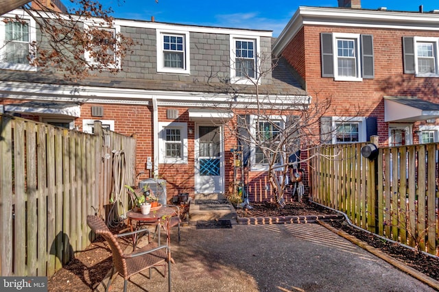 back of property featuring a patio