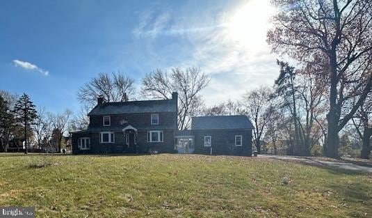 exterior space featuring a front lawn