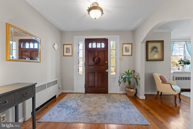 entryway featuring plenty of natural light, light hardwood / wood-style floors, and radiator heating unit