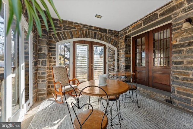 unfurnished dining area featuring french doors