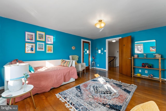 bedroom with wood-type flooring