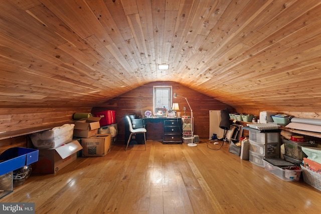 bonus room with wooden ceiling, wood walls, lofted ceiling, and light hardwood / wood-style flooring