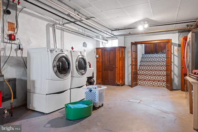 laundry area featuring washing machine and clothes dryer