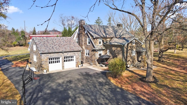 tudor home featuring a garage