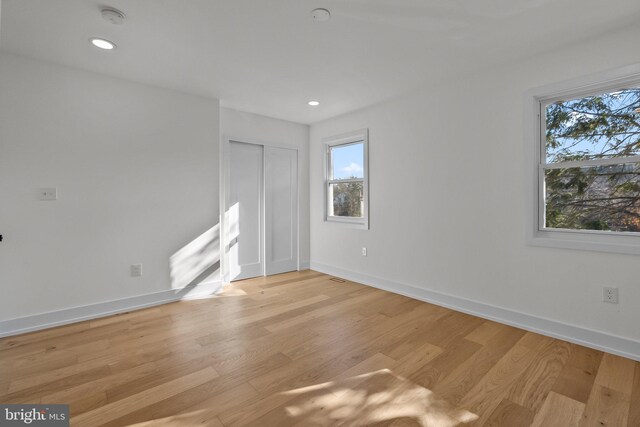 spare room with light wood-type flooring