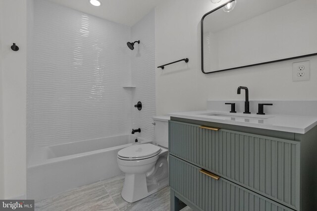 full bathroom with vanity, toilet, and tiled shower / bath combo