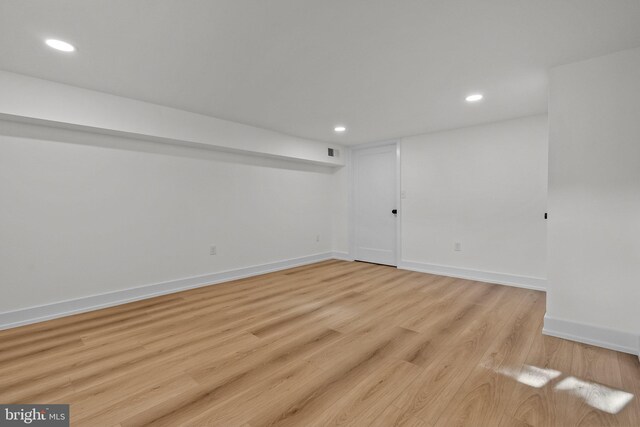 basement featuring light hardwood / wood-style flooring