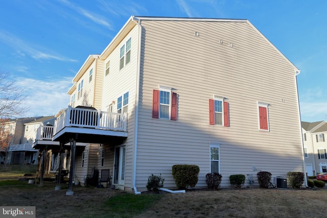 view of side of property featuring central air condition unit