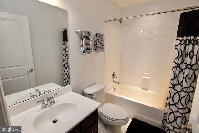 full bathroom featuring vanity, shower / bath combo, and toilet