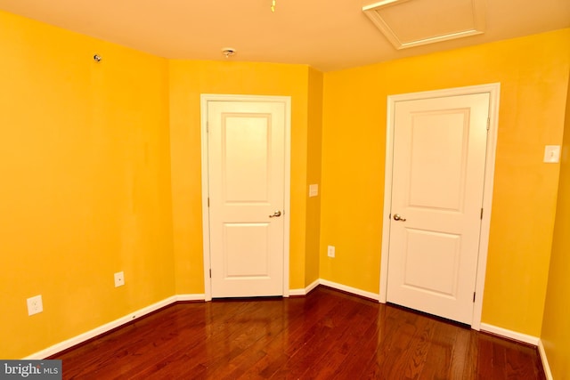 empty room with wood-type flooring