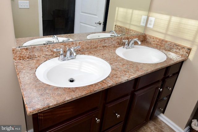 bathroom with tile patterned flooring and vanity