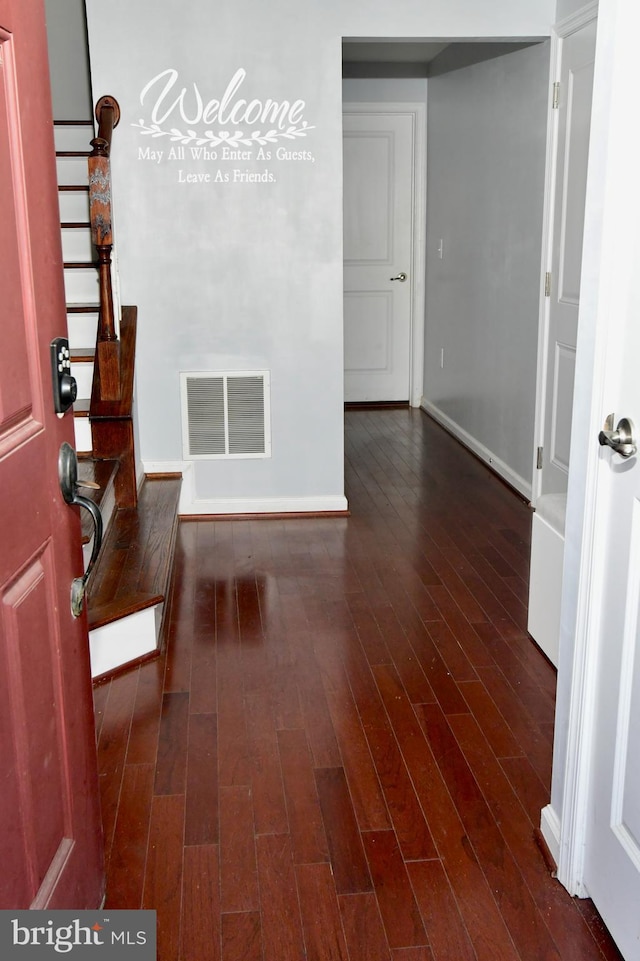 corridor featuring dark hardwood / wood-style flooring