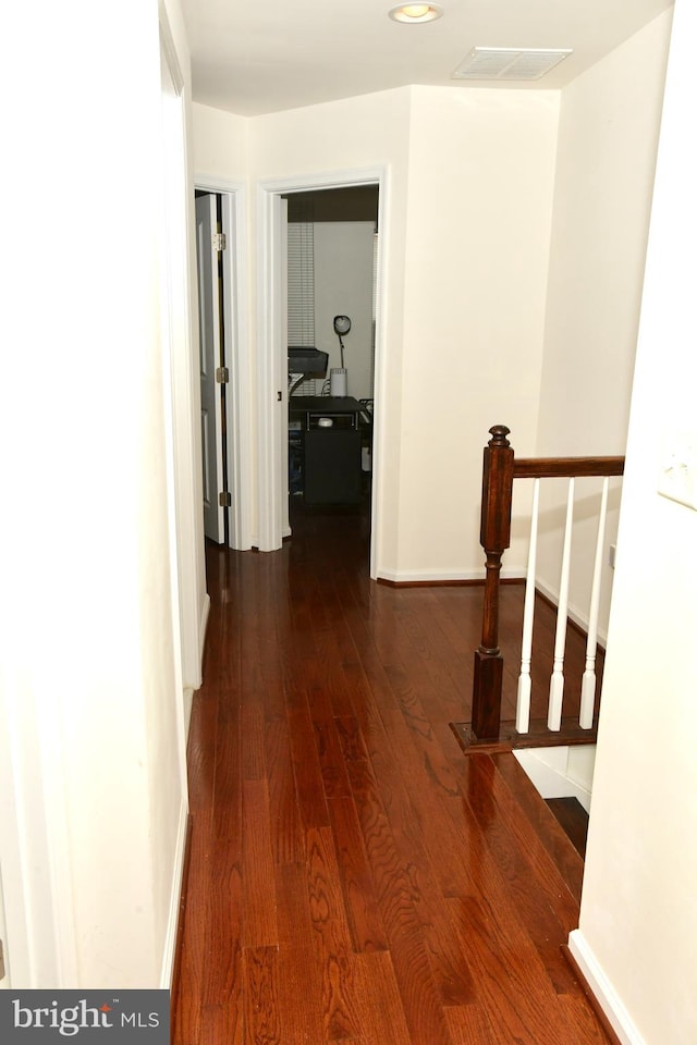 hall with dark hardwood / wood-style floors