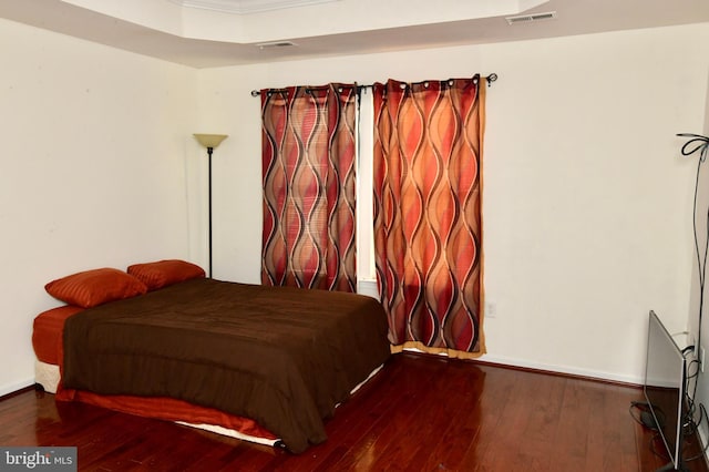 bedroom with wood-type flooring