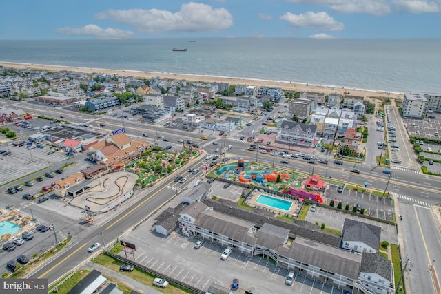 bird's eye view with a view of the beach and a water view