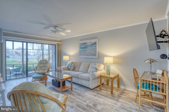 living room with crown molding, ceiling fan, and light wood-type flooring