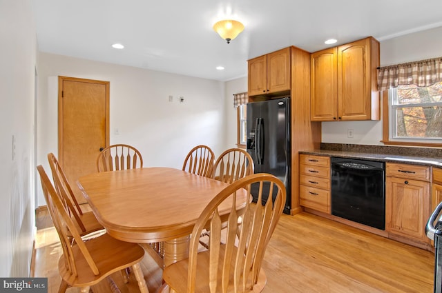 kitchen featuring black appliances and light hardwood / wood-style floors