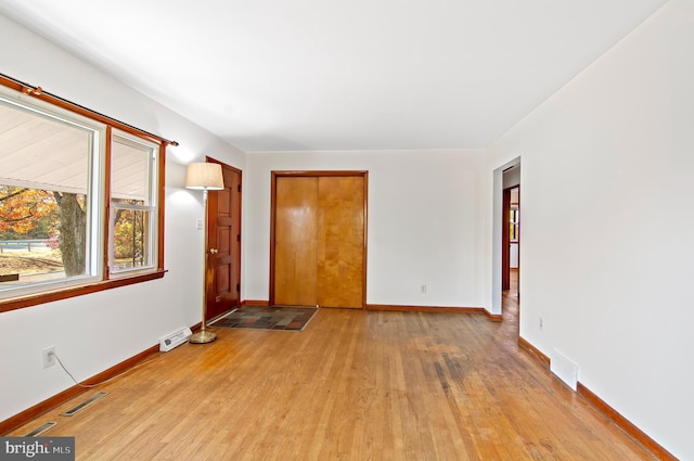 unfurnished room featuring light wood-type flooring