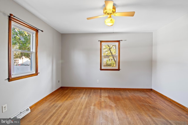 unfurnished room featuring light wood-type flooring and ceiling fan