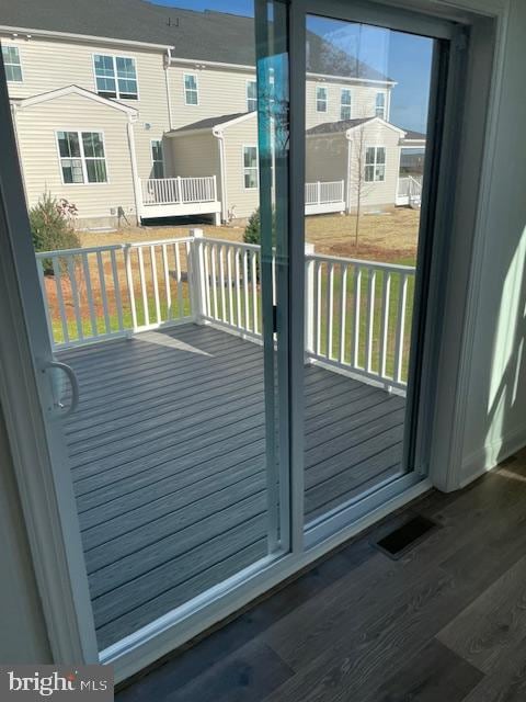 doorway to outside with dark wood-type flooring