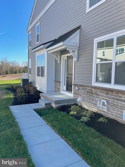 entrance to property with a yard