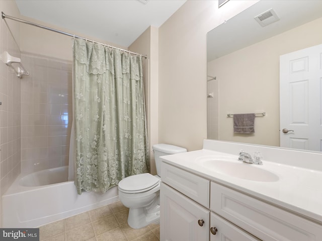 full bathroom with toilet, tile patterned floors, vanity, and shower / tub combo with curtain