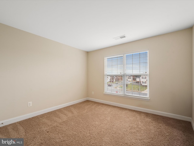 spare room with carpet flooring